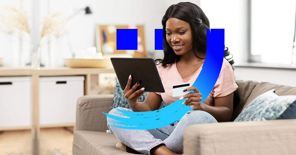 A sitting woman holding a tablet